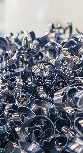 a pile of metal shavings. spirals and zigzags made of metal. production waste