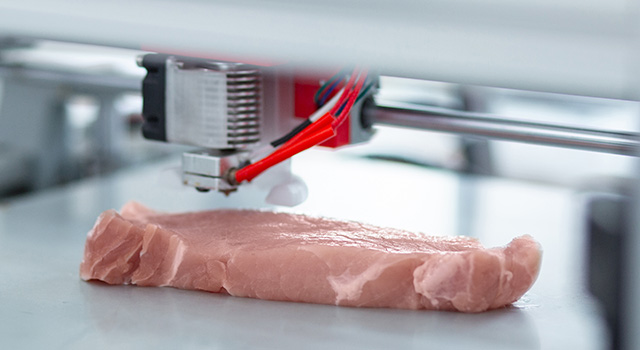 Perfect imitation. The close up of a modern 3D printer making a piece of meat and imitating all the details exactly