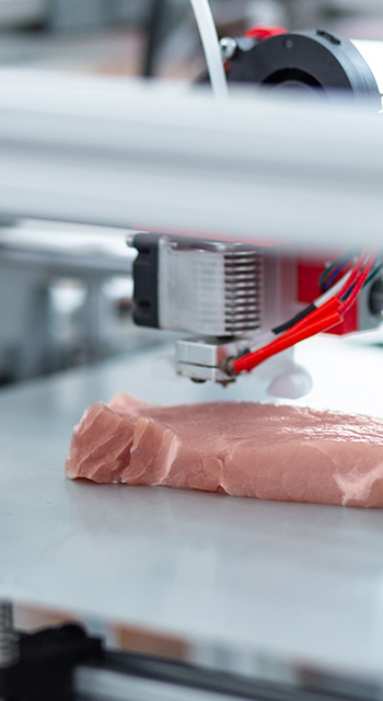 Perfect imitation. The close up of a modern 3D printer making a piece of meat and imitating all the details exactly