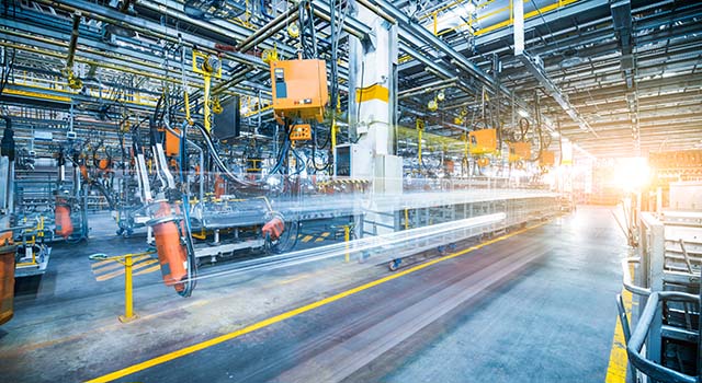 robots welding in a car factory