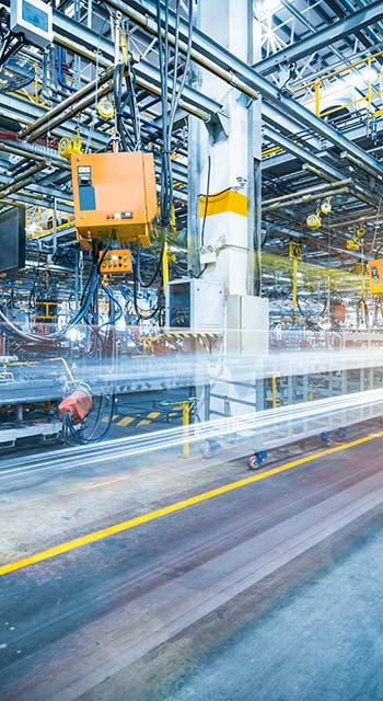 robots welding in a car factory
