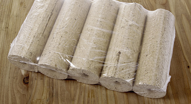 A pack of wooden briquettes on a table