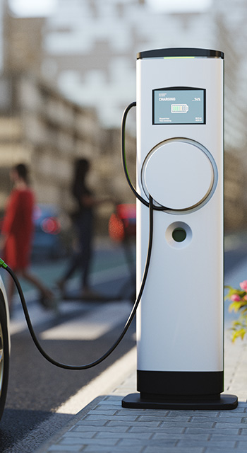 An electric vehicle at a charging station in the city. All items in the scene are 3D, charging station and concept cars are not based on any real ones.