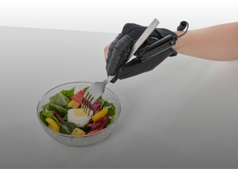 Photo of the Neomano robo-glove in action